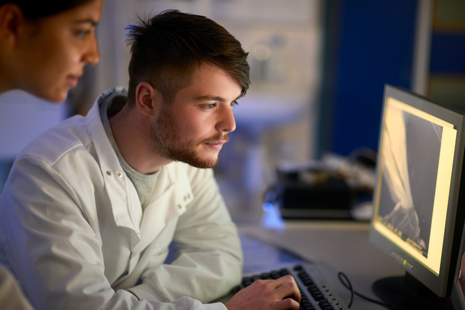 Scientist in laboratory using computer