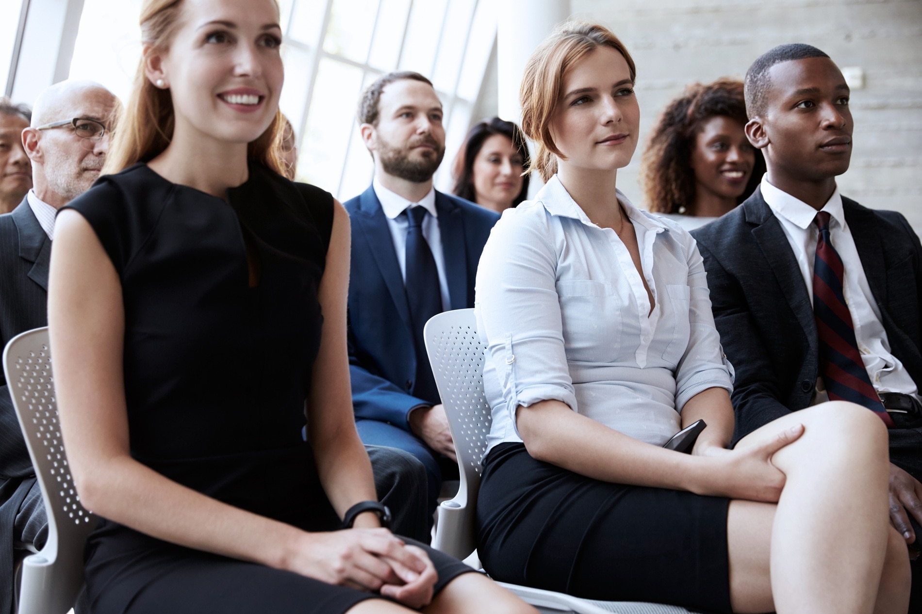 Audience Listening To Speaker At Business Conference