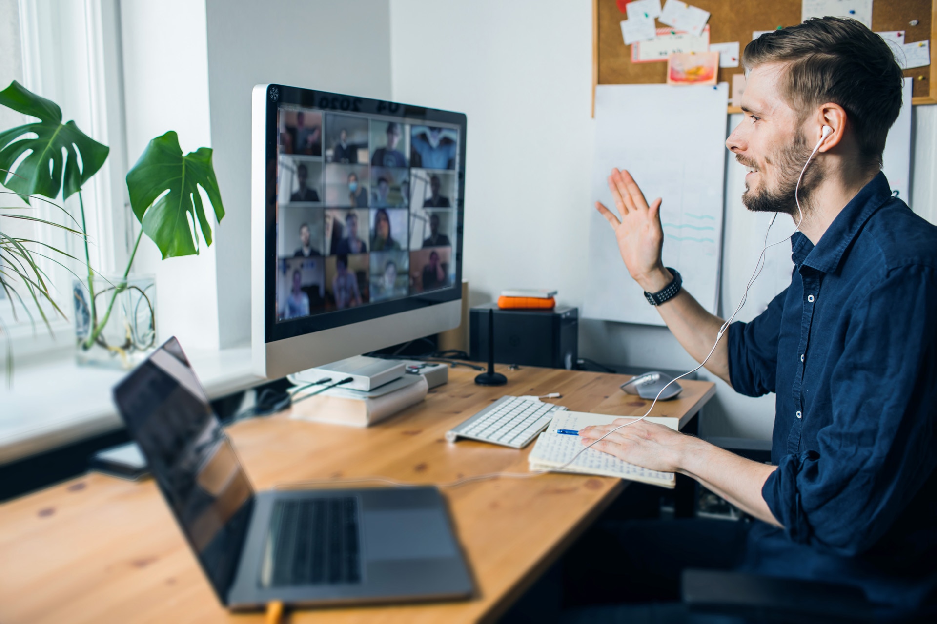Business video conferencing. Young man having video call via computer in the home office. Multiethnic business team. Virtual house party. Online team meeting video conference calling from home; Shutterstock ID 1725467707; buyer: -; po: -; job: -; end: -