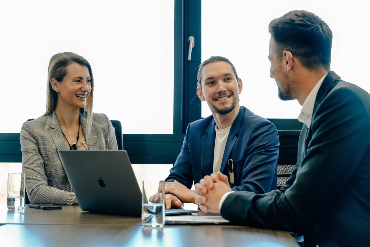 Meeting with two men and a woman