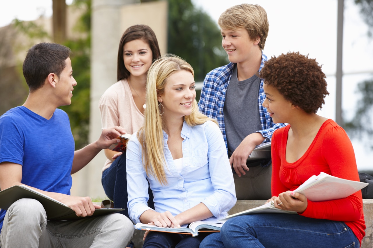 Multi racial student group sitting outdoors; Shutterstock ID 280370789; Cost assignment TYPE. (options: Cost Center / PO / Project No): 4700550; Number of Cost Center or PO or Project Number? Example: 654234: 600028; Sonova Brand: Phonak