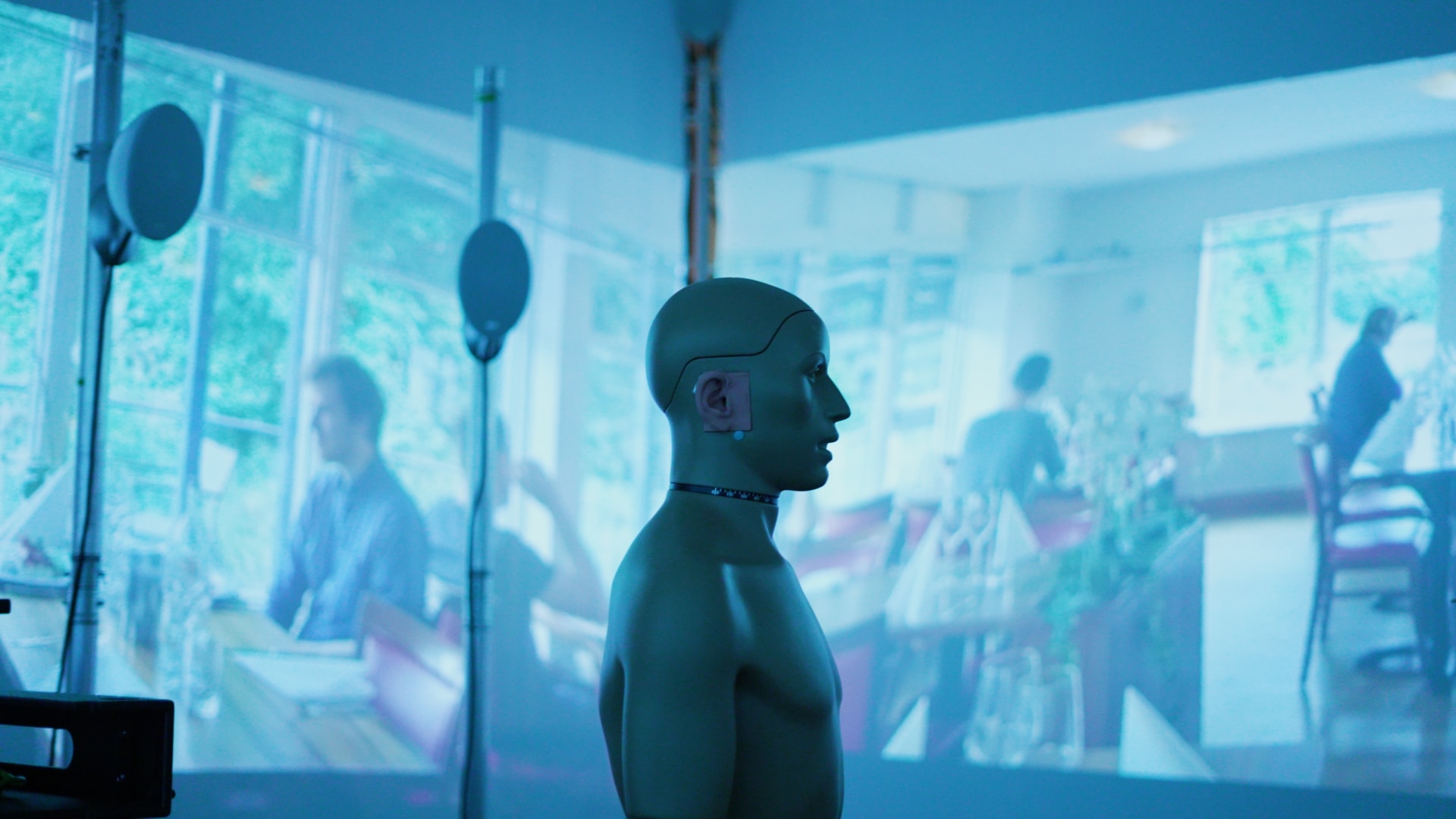 An interior of a real life sound lab with a humanoid  dummy in the center