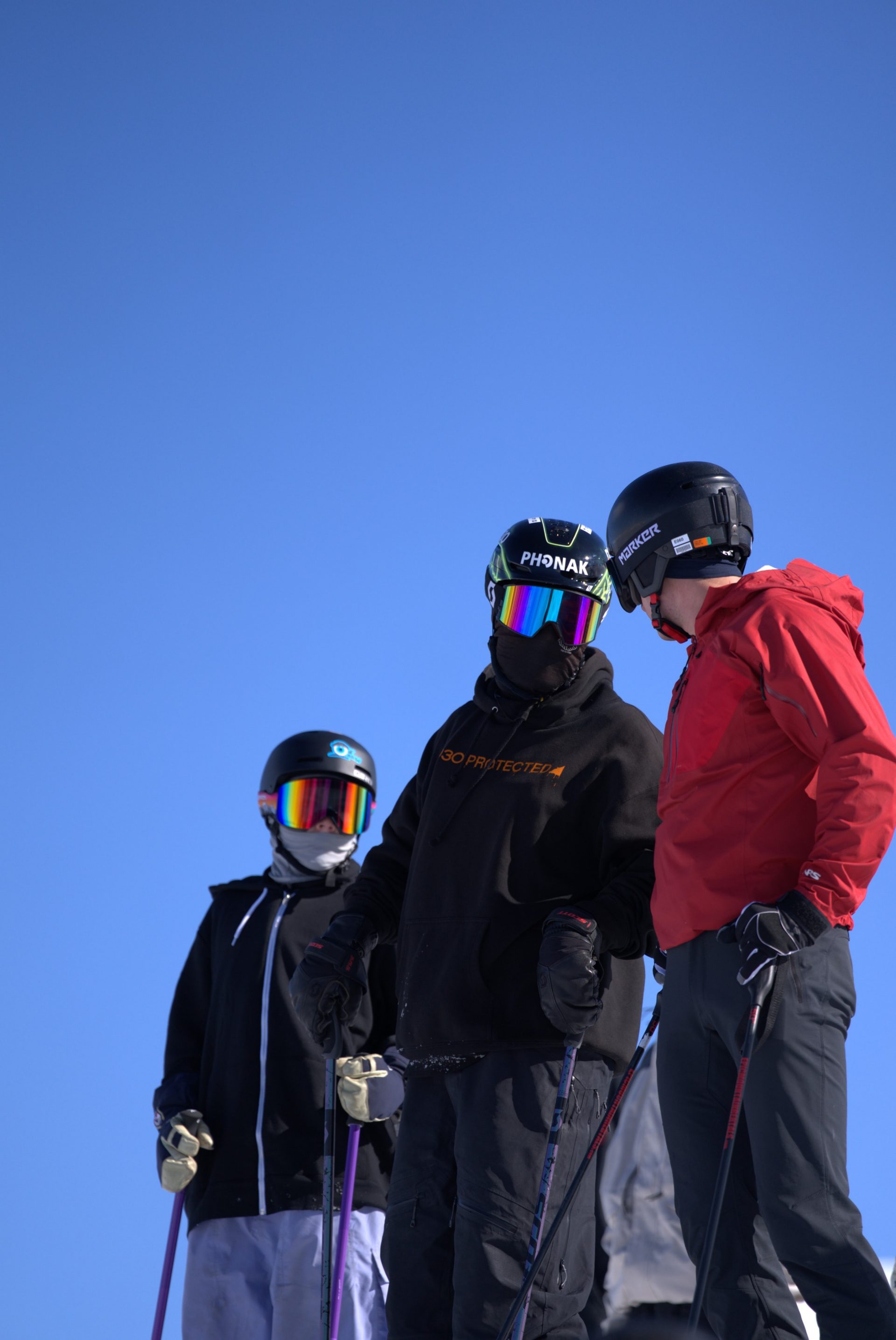 Robin Gillon, Olympian Aaron Small, and 13-year-old Emmett Haaland take a moment on the slopes at Woodward Park City during the Hear My Life Ambassador Relay, a mentorship initiative empowering young athletes with hearing loss.