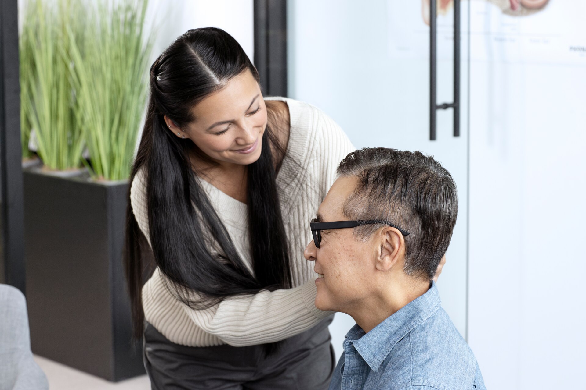 Audiologist with client