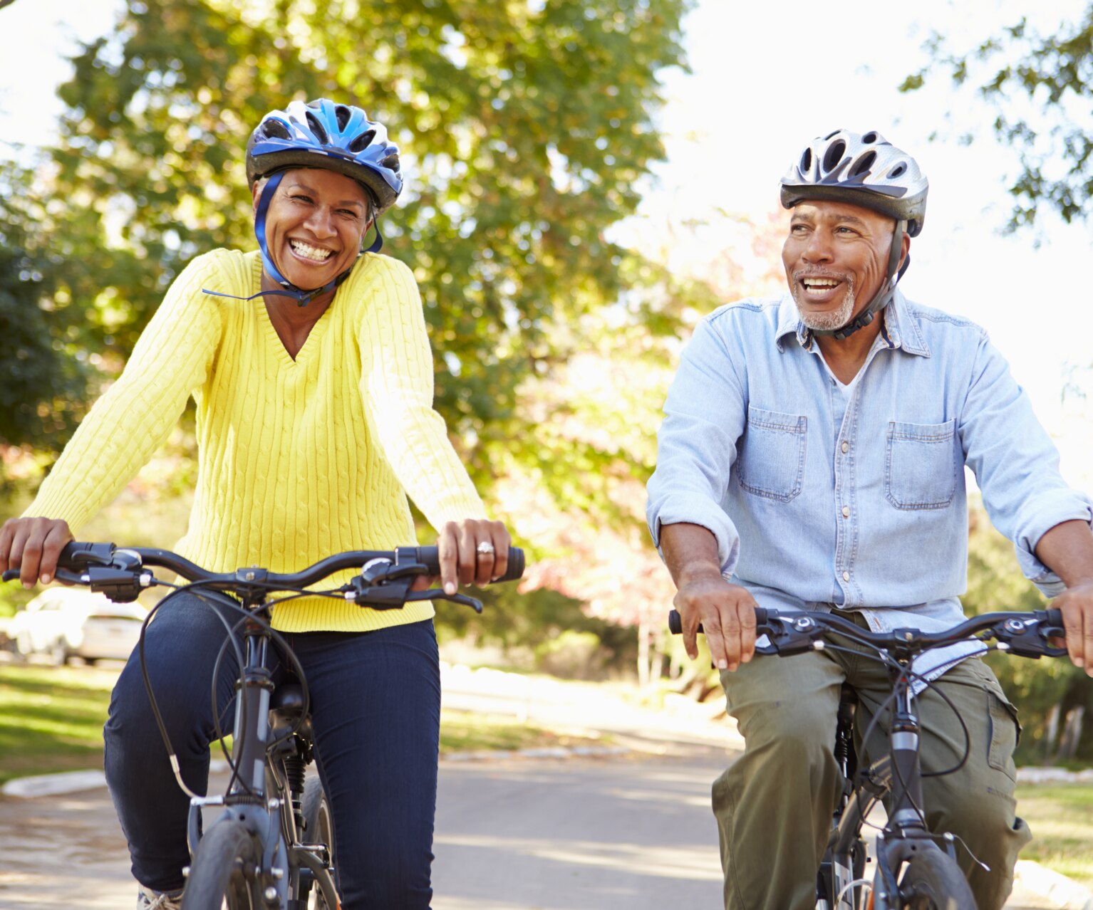 Senior Couple On Cycle Ride In Countryside