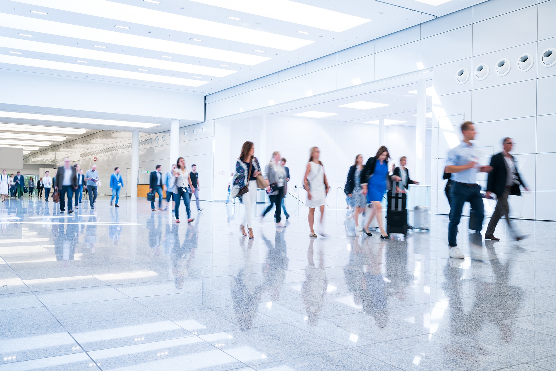 1211594461 blurred business people at a trade fair; Shutterstock ID 1211594461; purchase_order: -; job: -; client: -; other: -