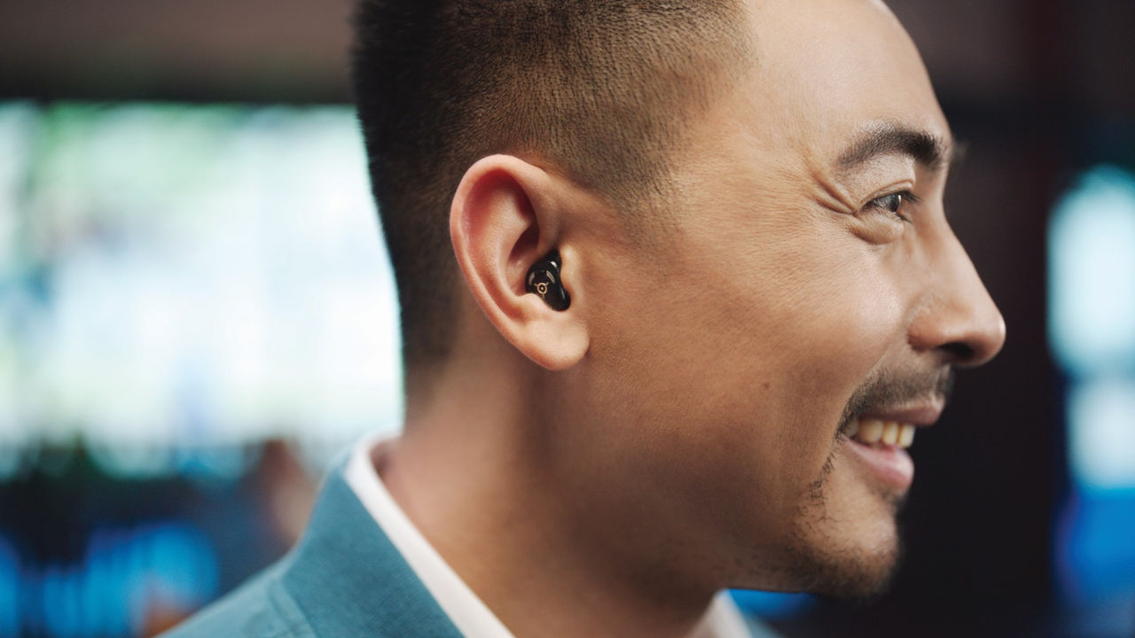 Man side profile with hearing aid