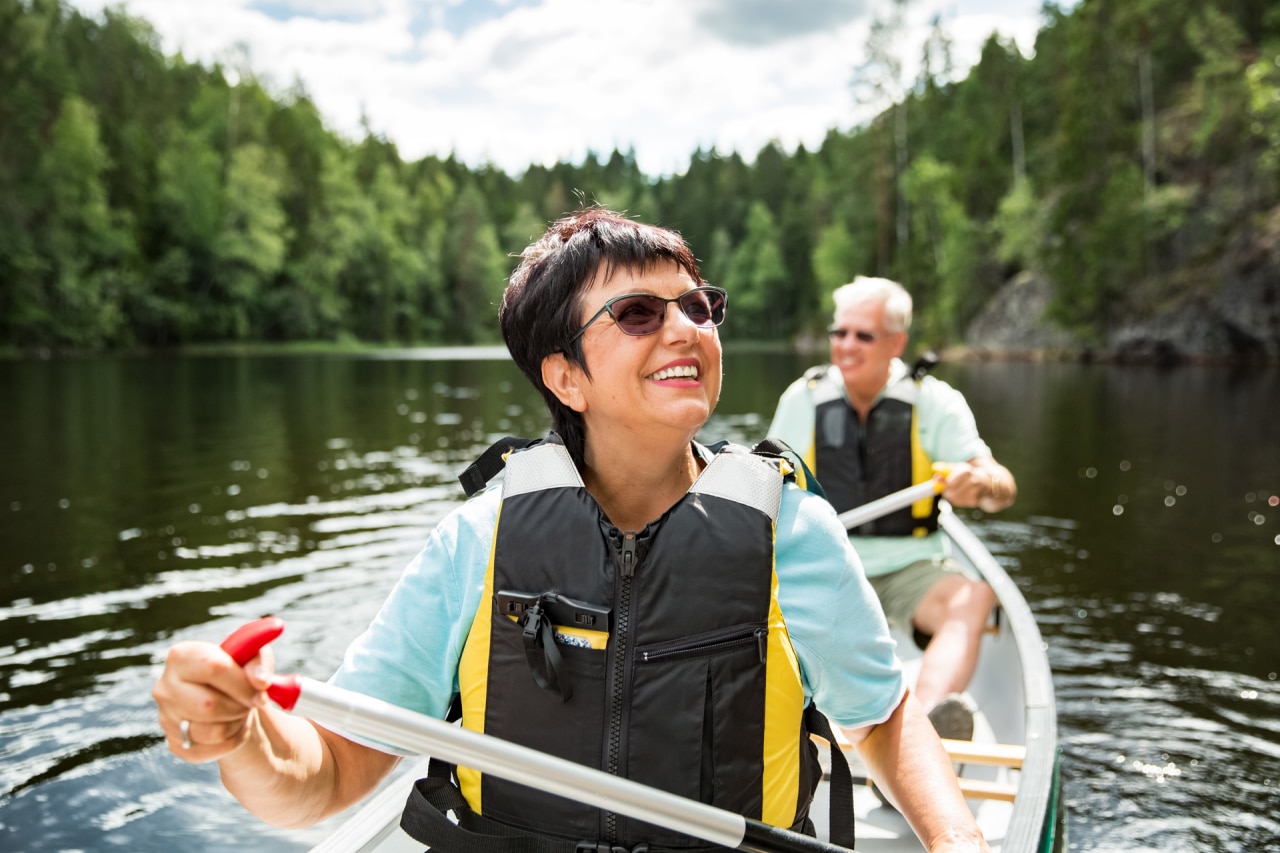 A mature couple enjoying the river in a canoe