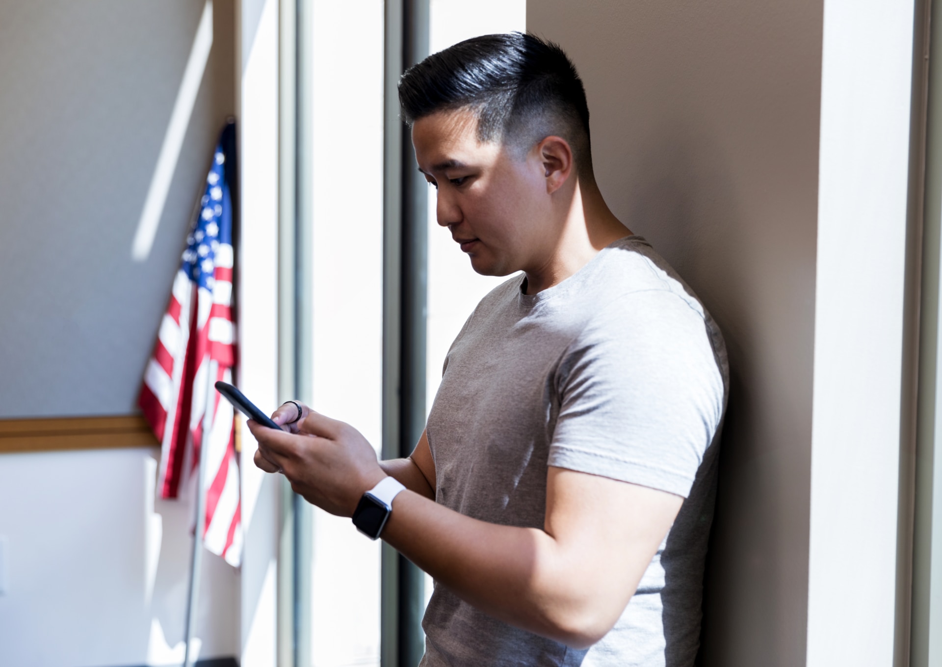 Veteran looking at his phone