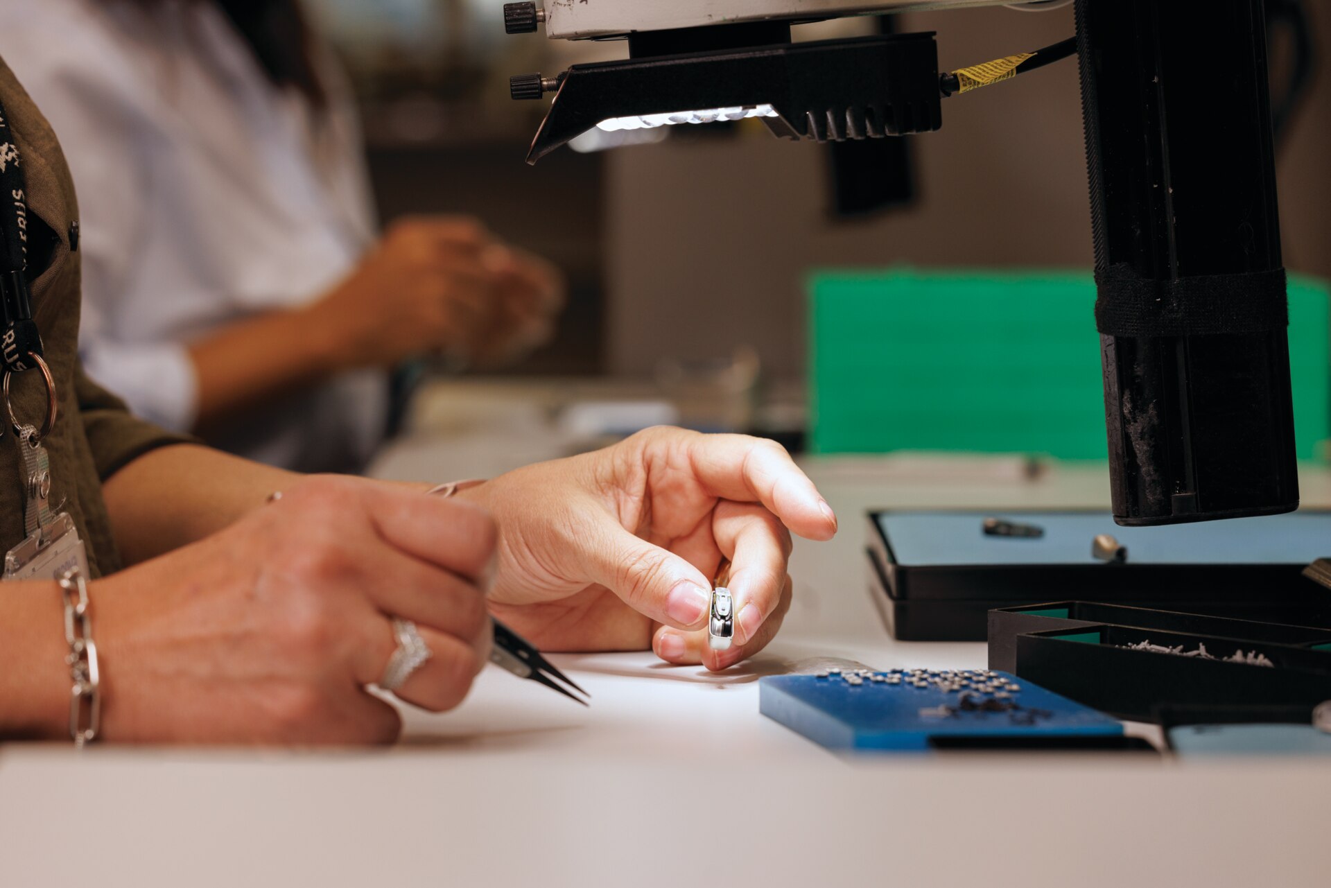 A female scientist inspecting a hearing aid, doing research Phonak testing hearing aids