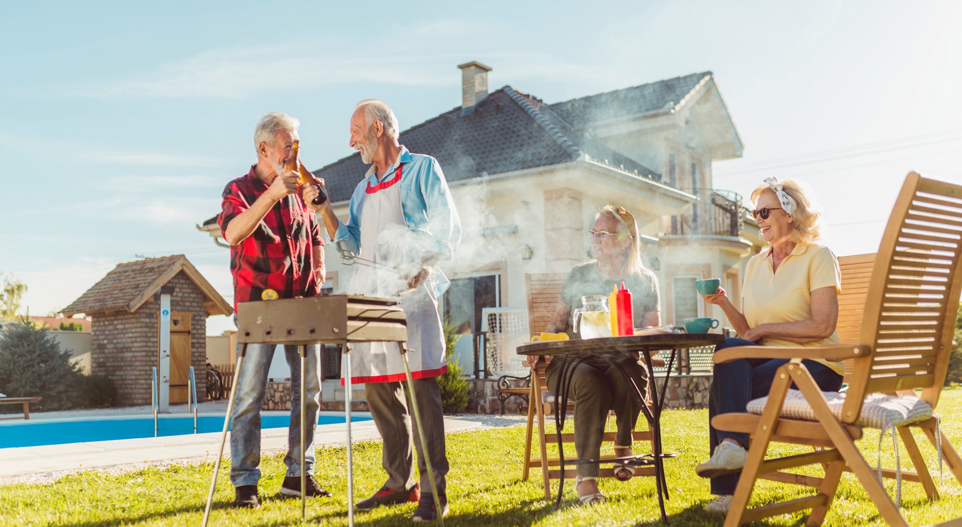 Elderly neighbors having backyard barbecue party Elderly neighbors having backyard barbecue party