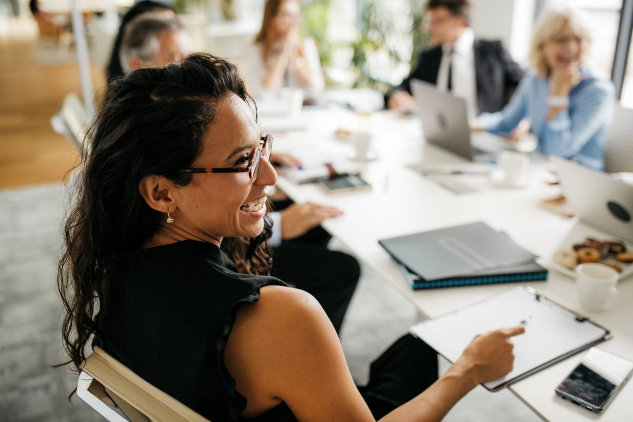 Group of people sitting at a conference table