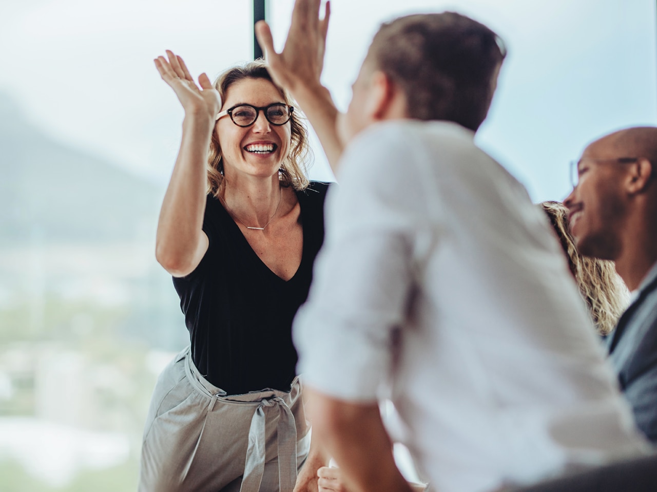 Two people high-fiving