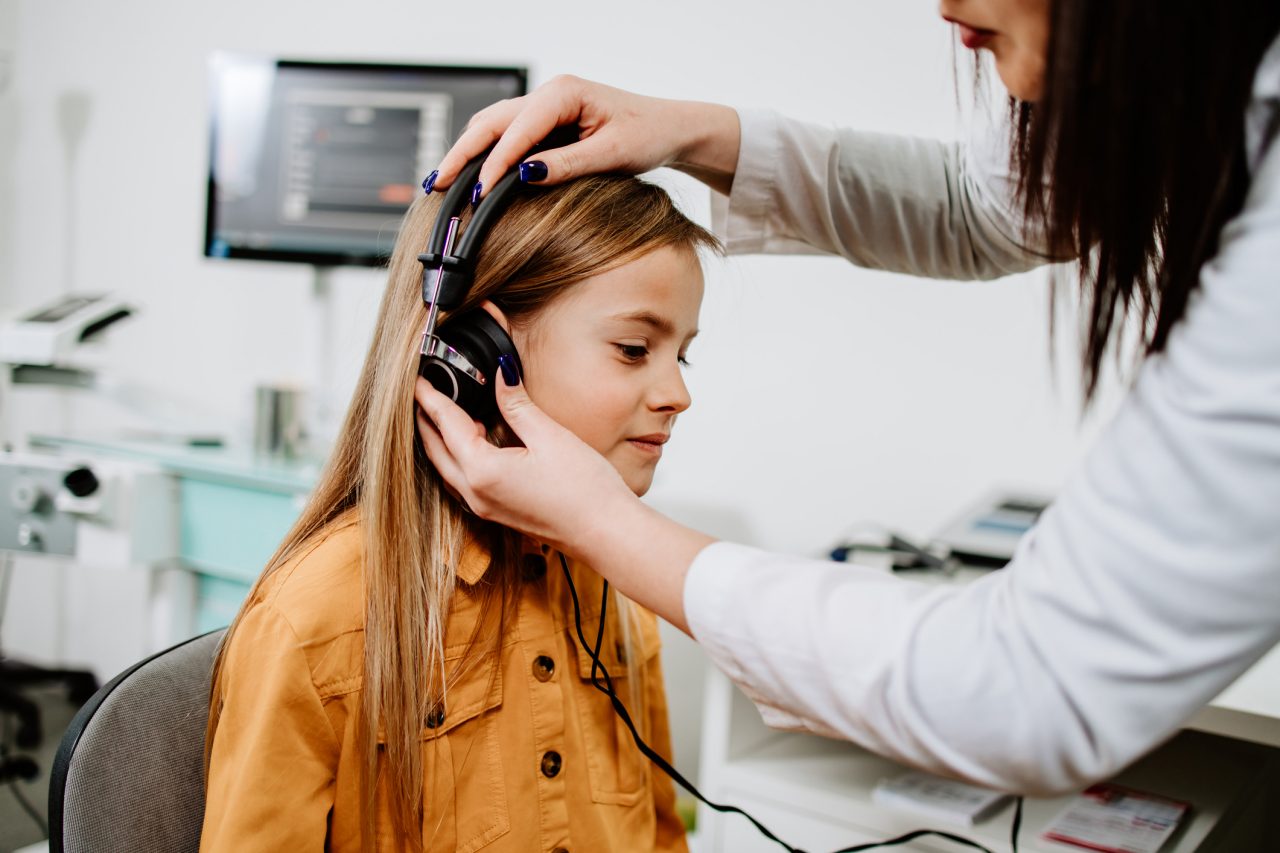 Pediatric patient getting hearing test