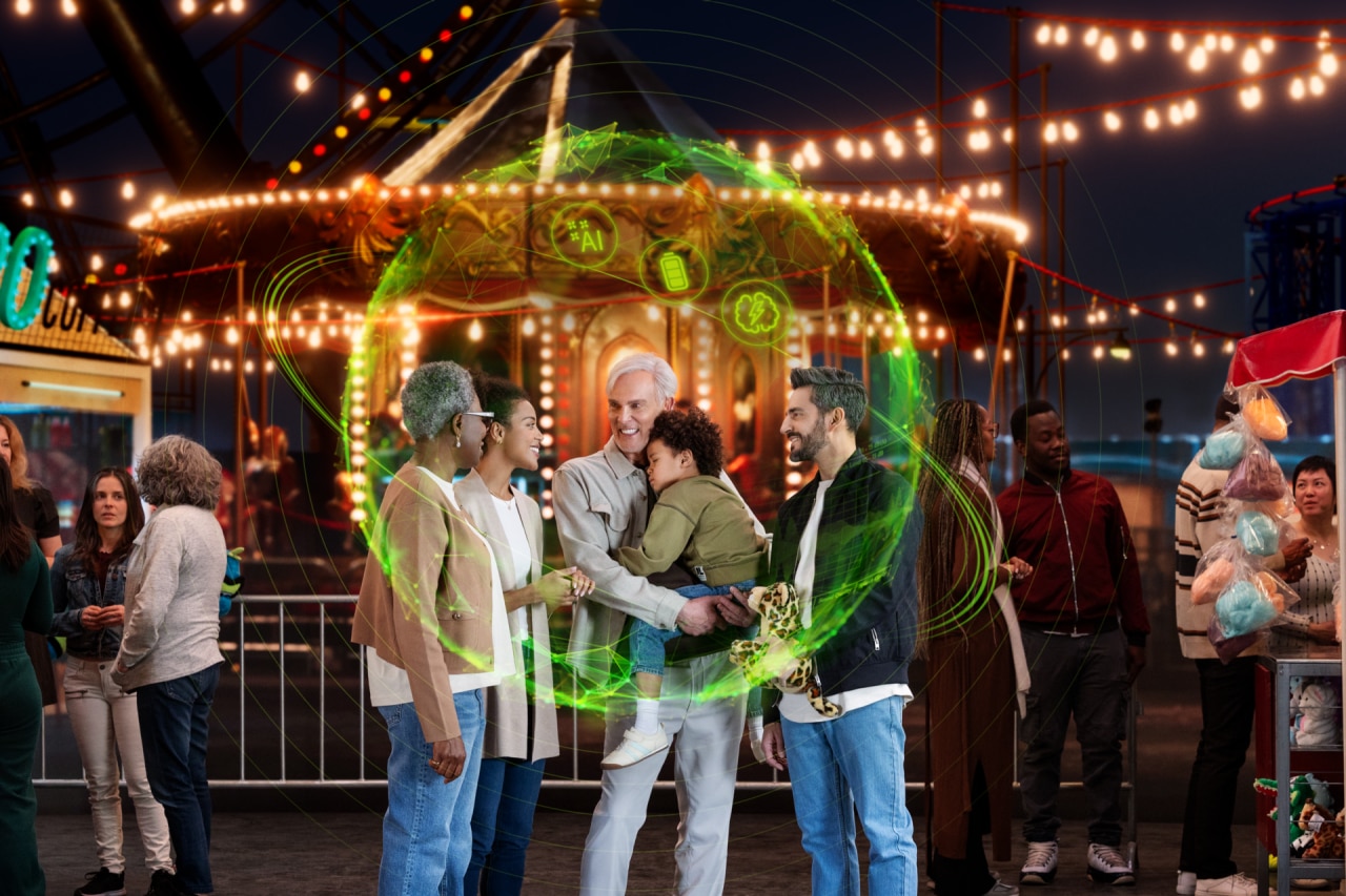 Small group talking in noisy fairground with green listening bubble