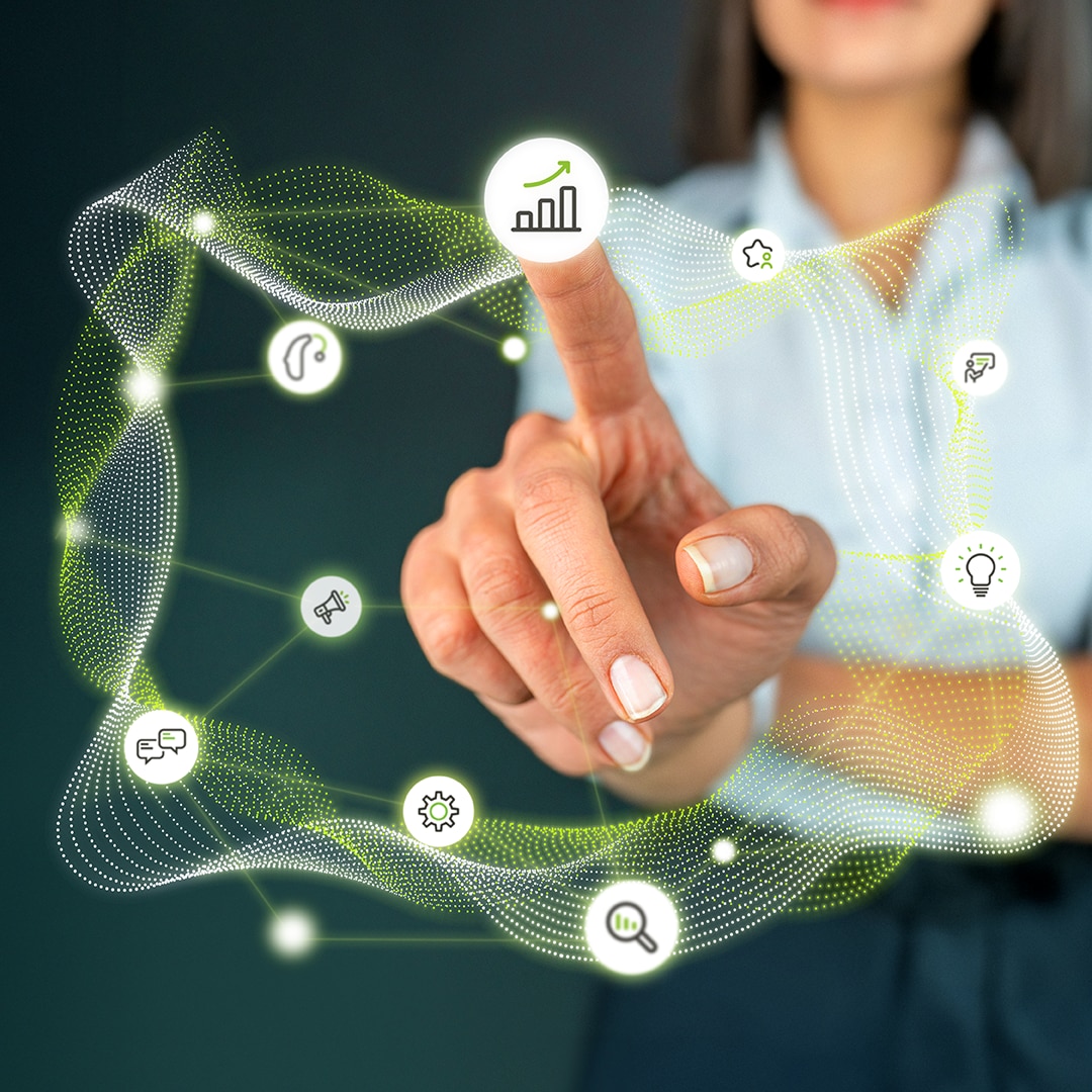 Female hand pointing to icon of bar graph