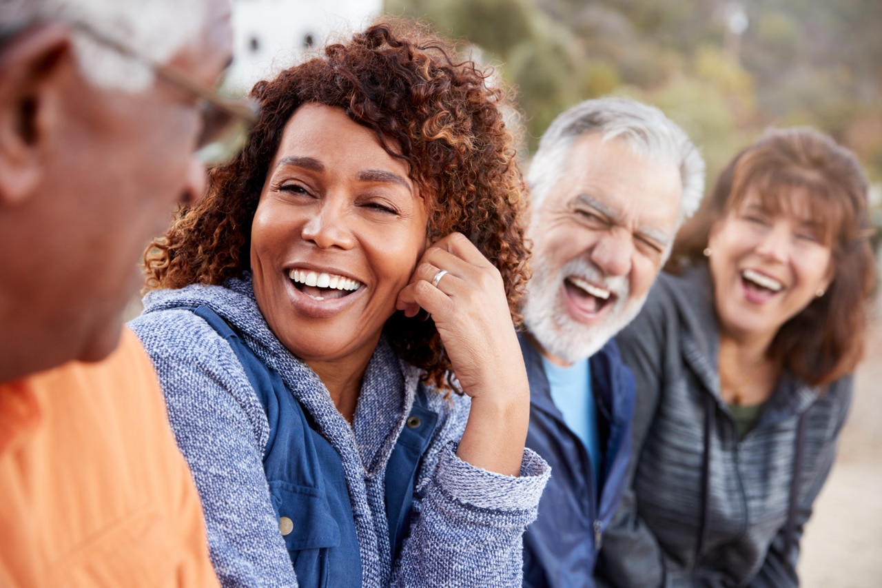 Group Of Senior Friends On Hike In Countryside Talking And Laughing Together; Shutterstock ID 1722921127; purchase_order: -; job: -; client: -; other: -