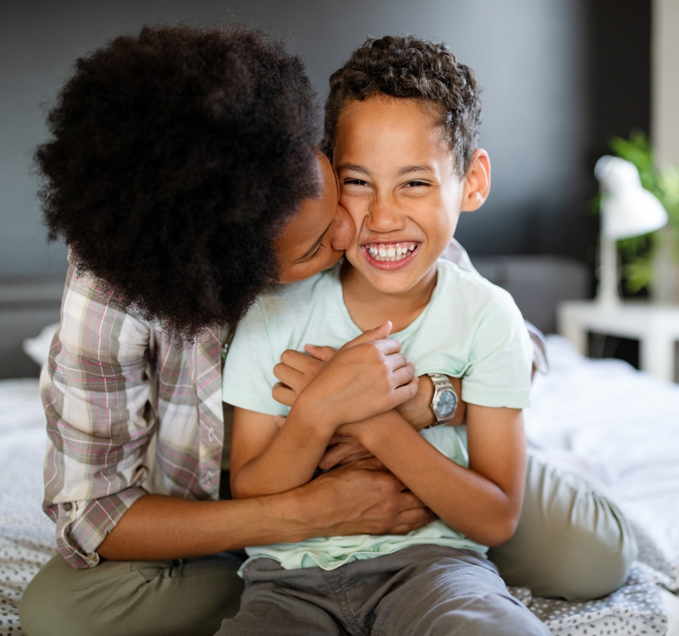 A happy african-american mother having fun with her child A happy african-american mother having fun with her child