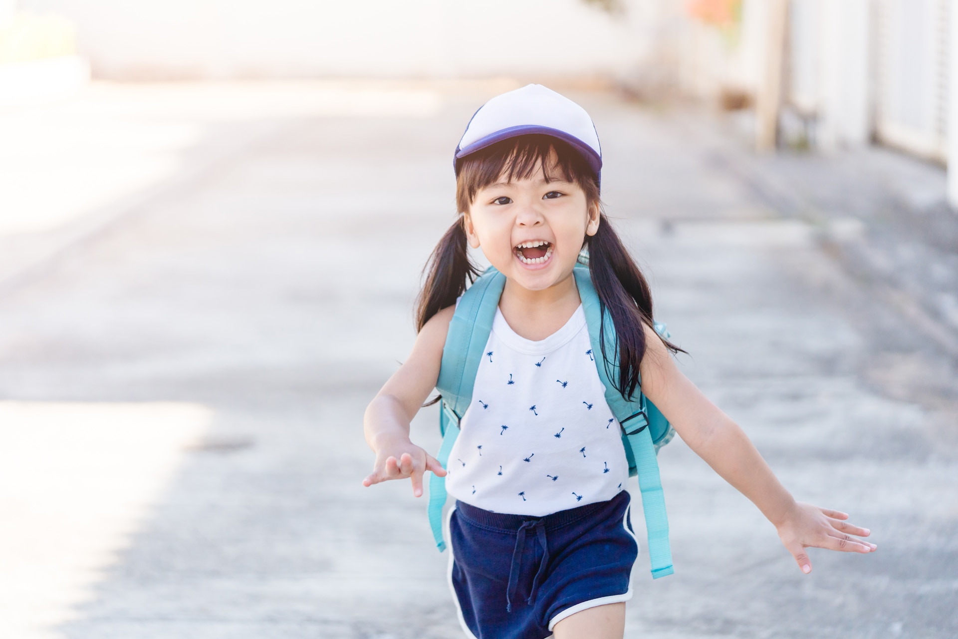 Back to School Concept.Happy Funny little asian girl running and very excited and glad when she go back to school.Happy toddler child from kindergarten school.School kid girl with japan bag.Education.; Shutterstock ID 1655502538; purchase_order: -; job: -; client: -; other: -